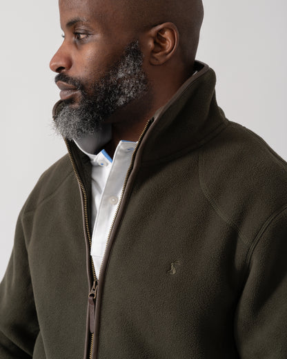 detail shot of a model wearing a Joules Mens Heritage Full Zip Fleece in Dark Green