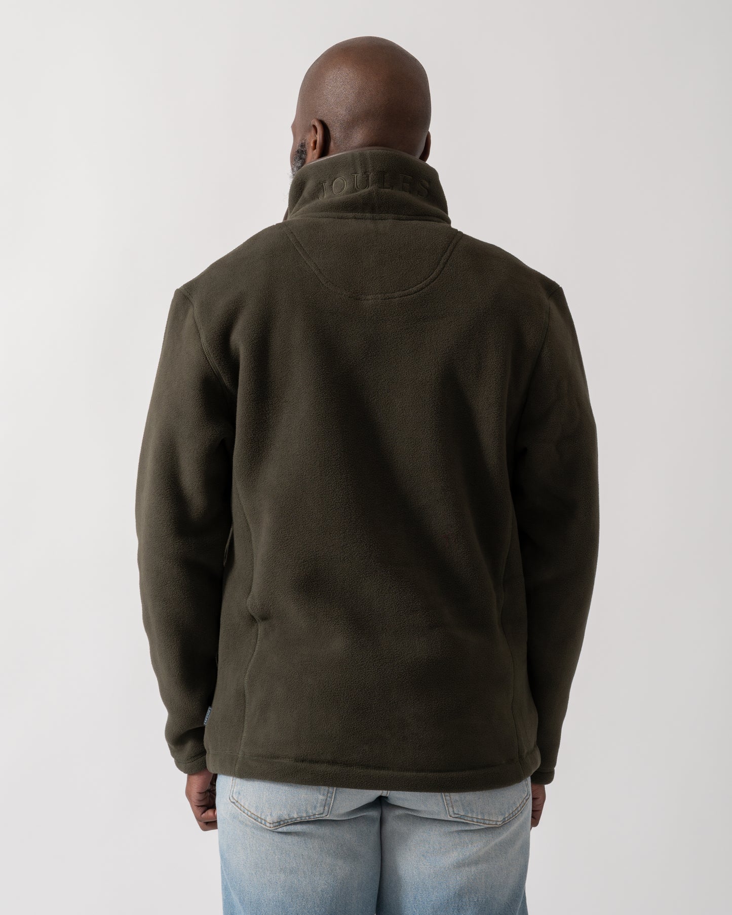back shot of a model wearing a Joules Mens Heritage Full Zip Fleece in Dark Green
