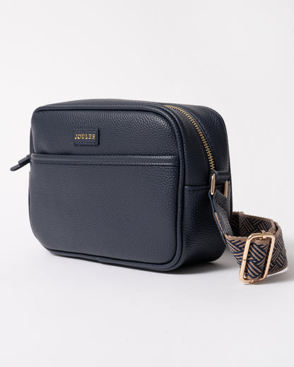 side of a Joules Trent Womens Faux Leather Crossbody Bag in Navy