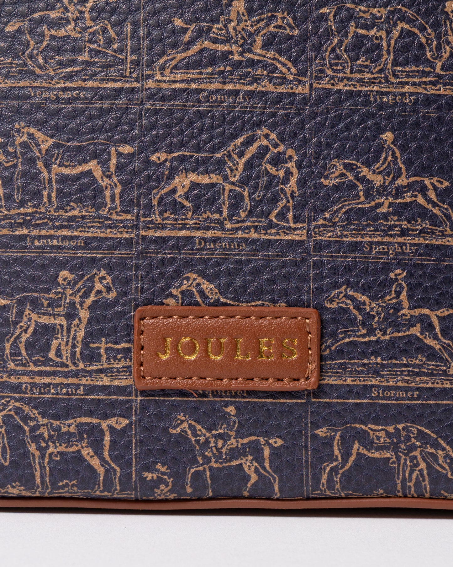 logo detail of a Joules Womens Bucket Bag in Navy Horse