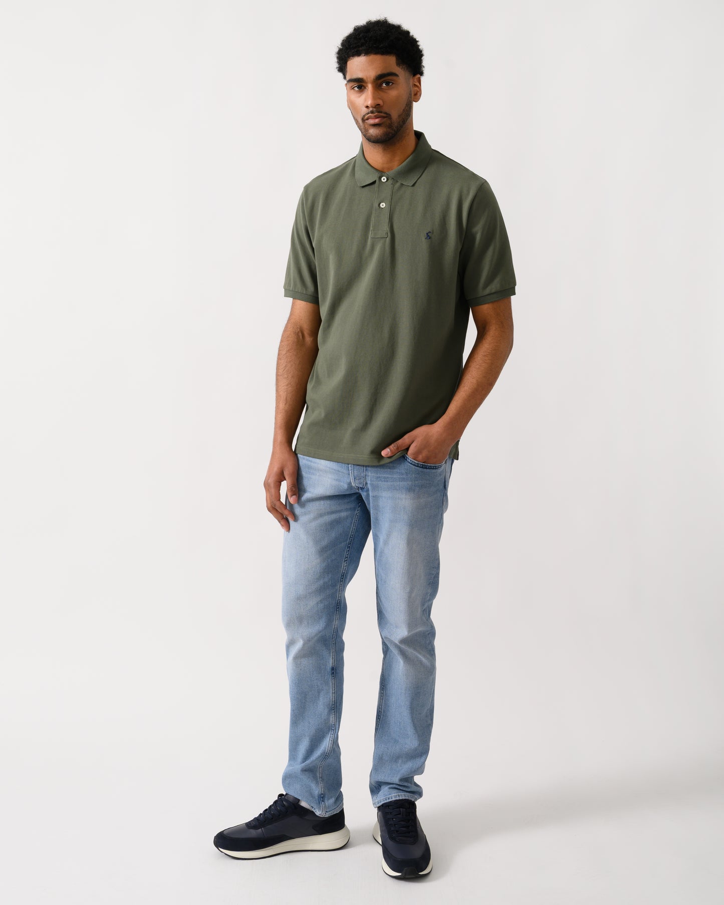 full length shot of a model Joules Woody Mens Polo Shirt in Khaki Green