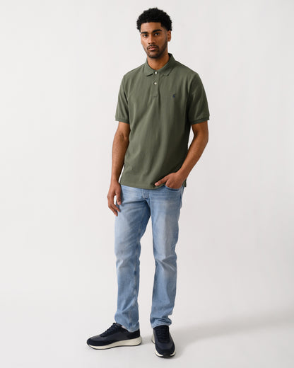 full length shot of a model Joules Woody Mens Polo Shirt in Khaki Green
