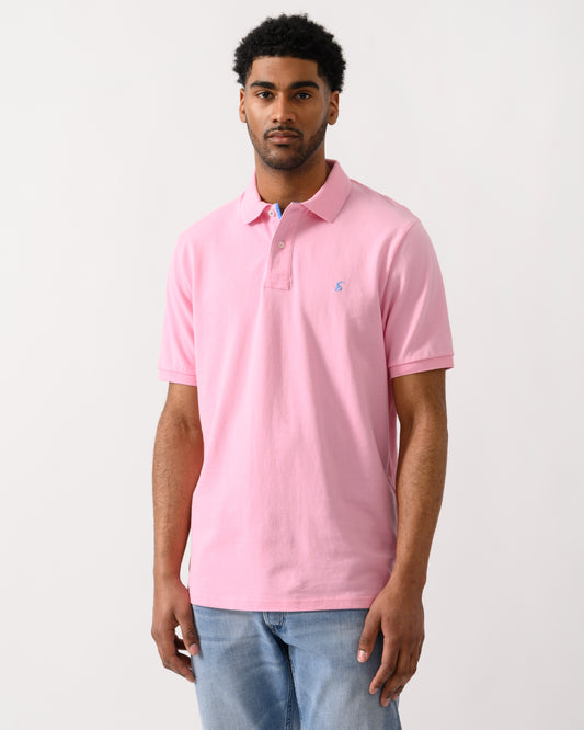 model wearing a Joules Woody Mens Polo Shirt in Light Pink