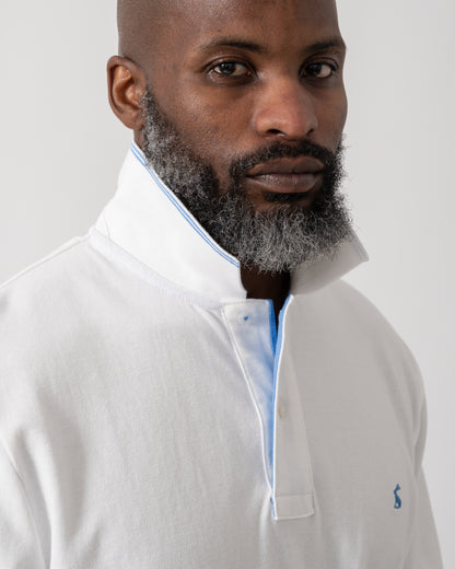 detail shot of a model wearing a Joules Woody Mens Polo Shirt in White