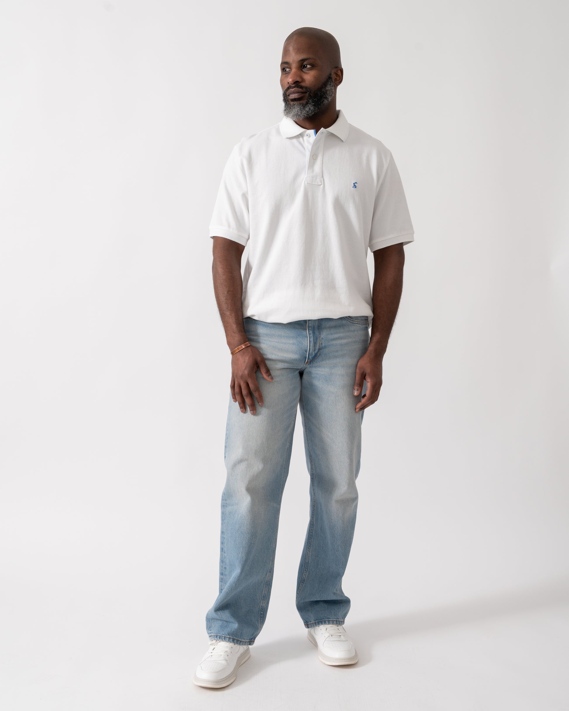 full length shot of a model wearing a Joules Woody Mens Polo Shirt in White