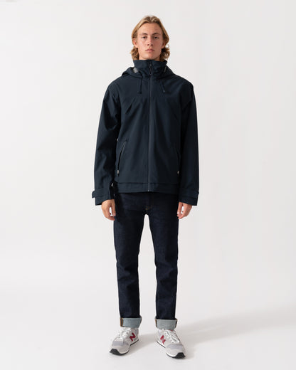 Man wearing the Joules Hadley Mens Waterproof Jacket - Navy zipped up