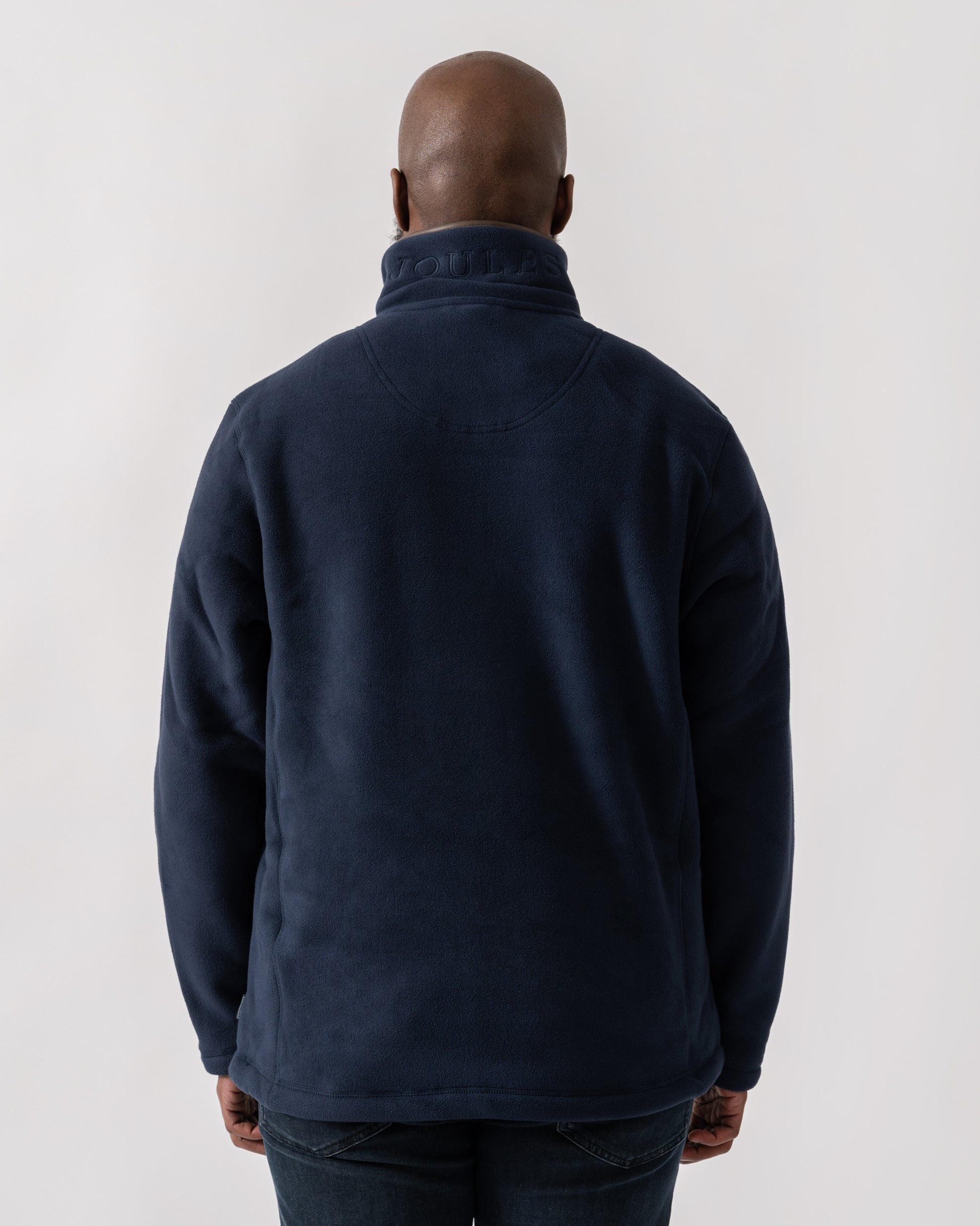 Model wearing Joules Mens Heritage 1/4 Zip Fleece in Navy - back
