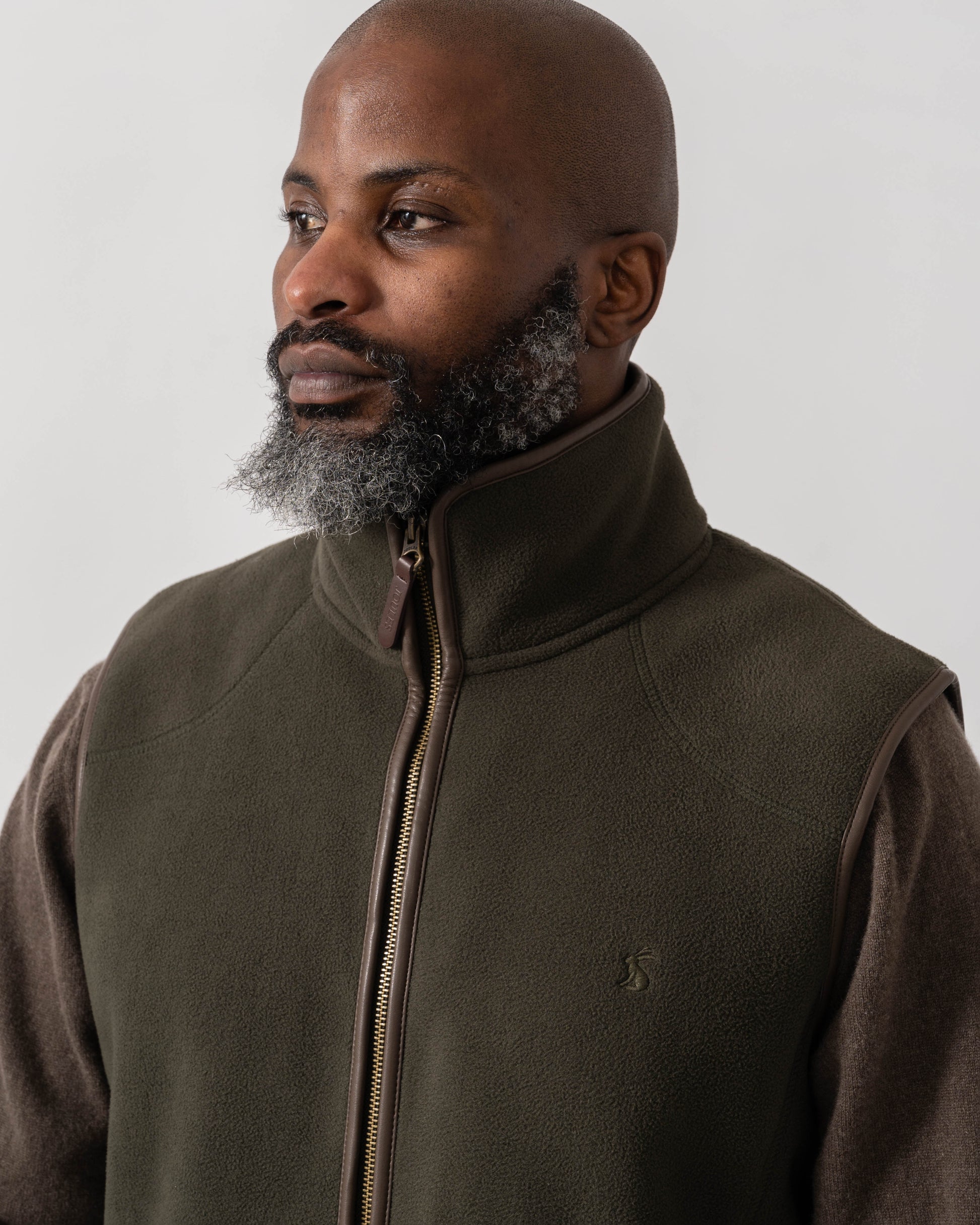 Model wearing Joules Mens Heritage Fleece Gilet in Green - Detail