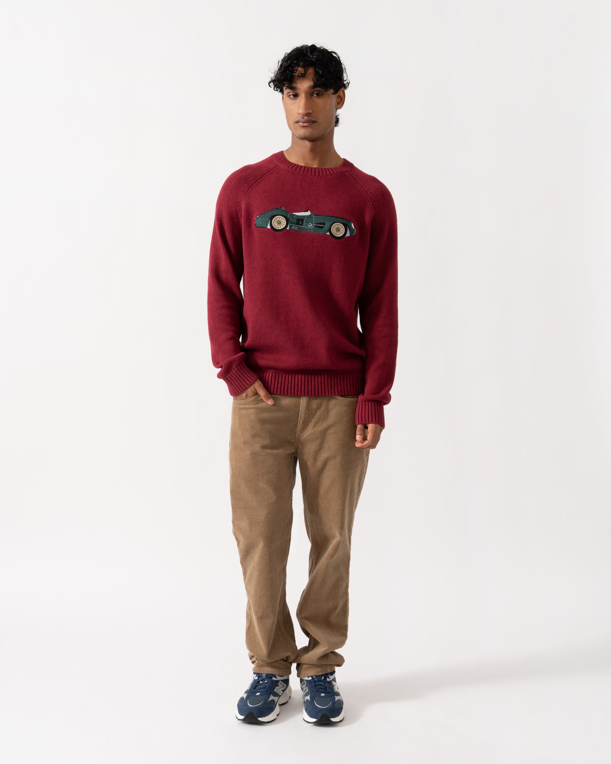 Man wearing the Joules Mens Intarsia Crew Neck Jumper - Burgundy/Car