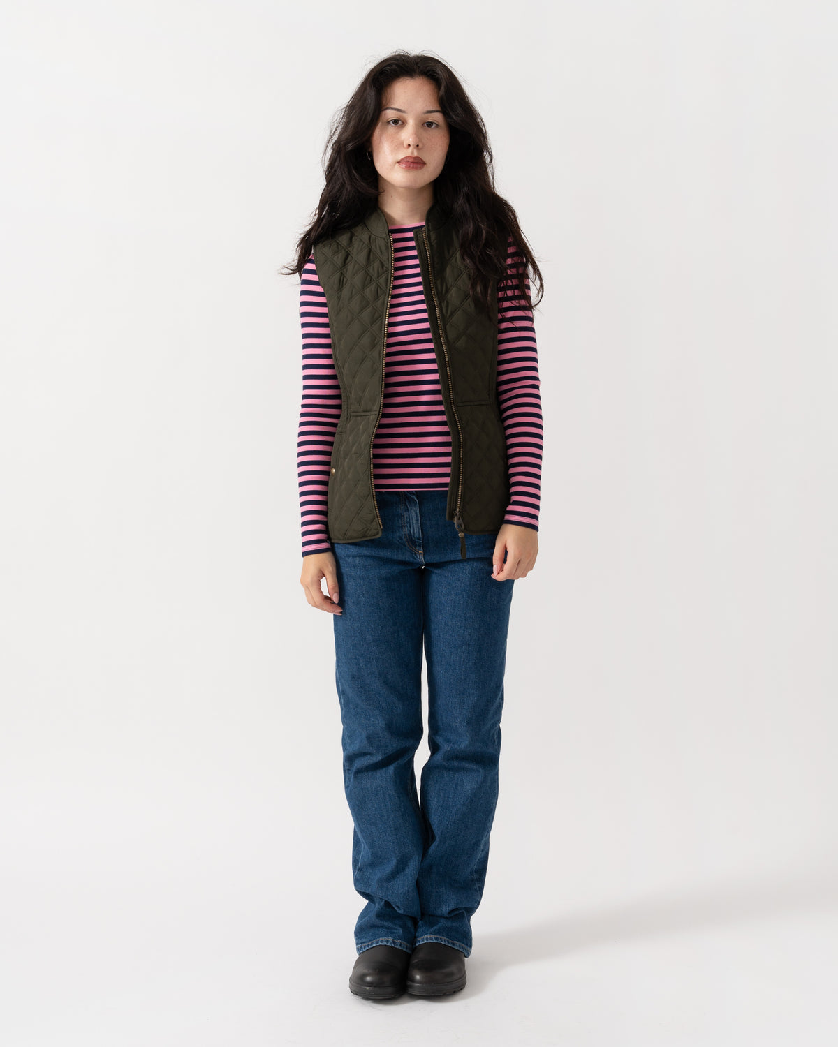 Model wearing the Joules Minx Womens Diamond Quilt Gilet - Rosemary Green