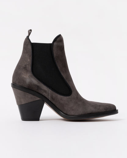 Gray suede ankle boot with a black sole on a white background