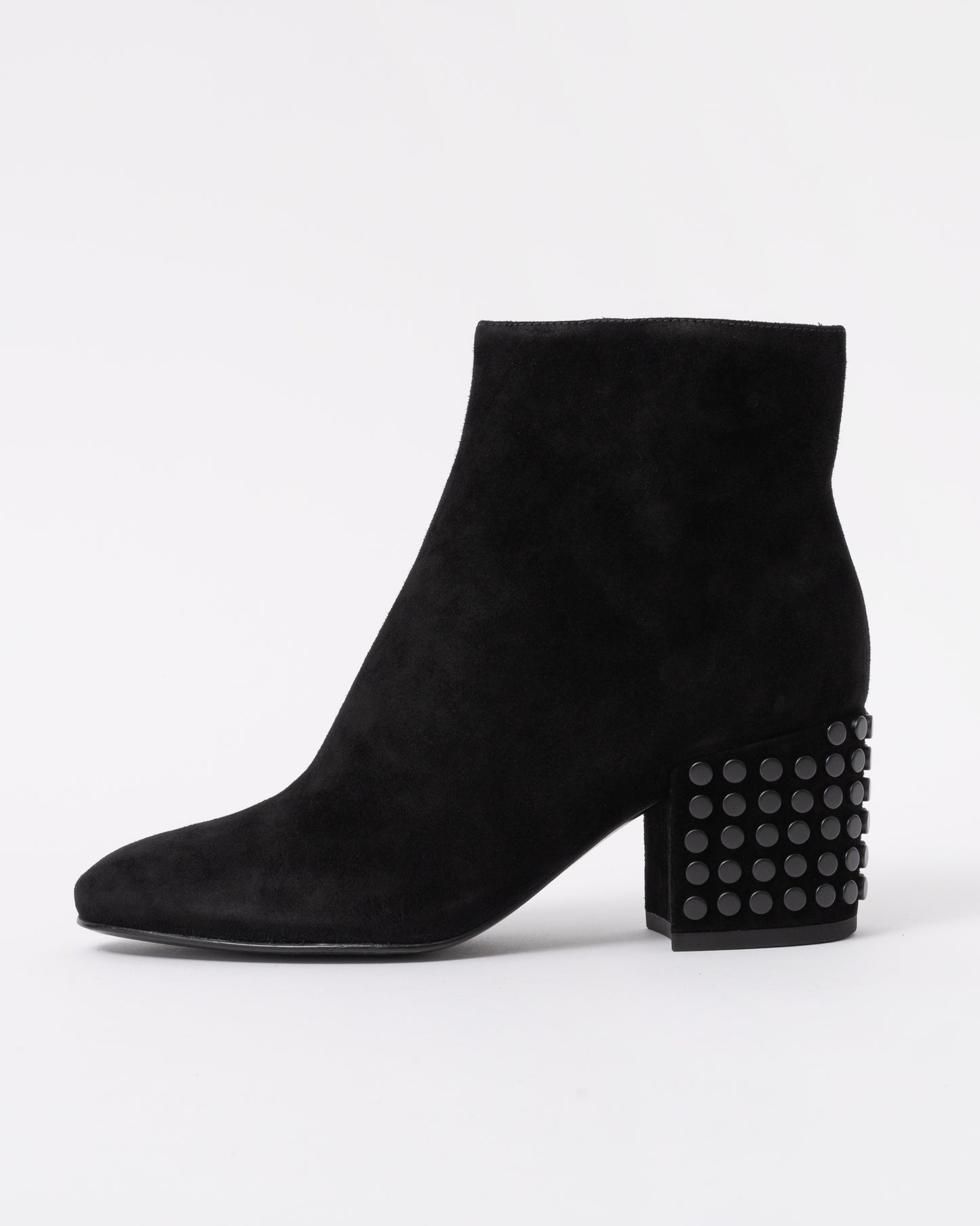 Black suede ankle boot with a textured block heel on a white background