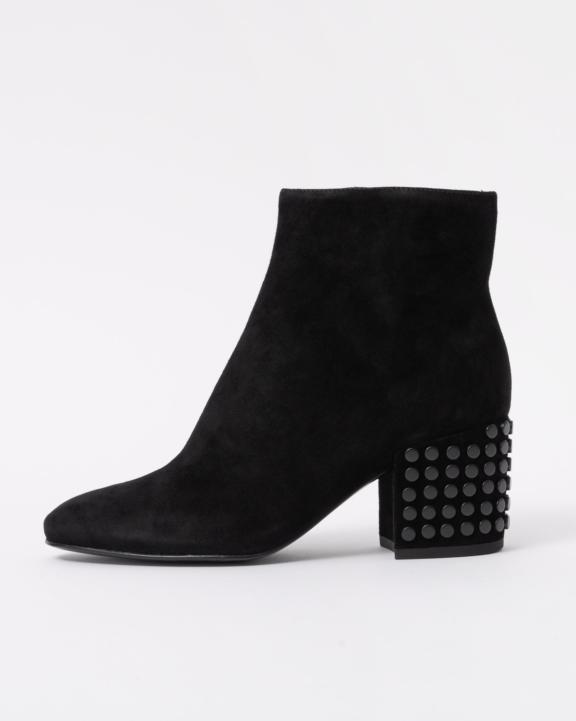 Black suede ankle boot with a textured block heel on a white background