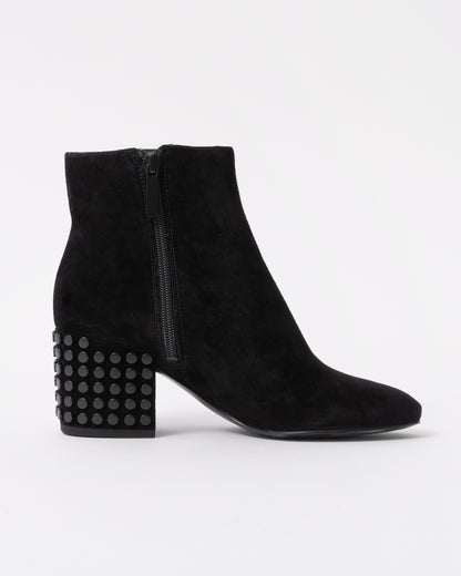 Black suede ankle boot with studded details on a white background