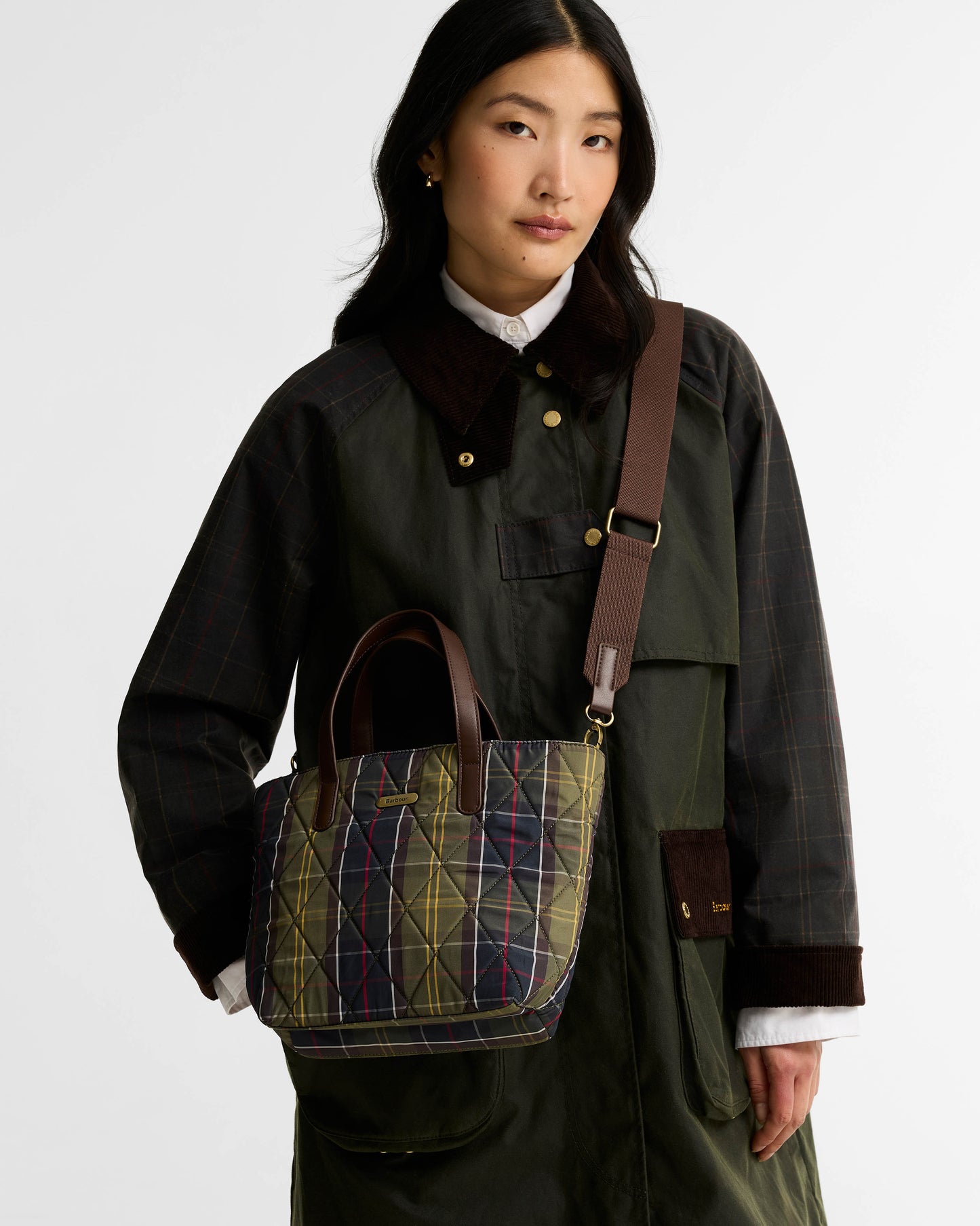 Barbour Womens Mini Quilted Tote Bag in Classic Tartan on model, shoulder strap