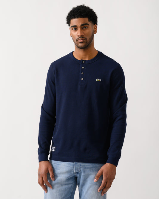 model wearing a Lacoste Boxy Tunisian Neck Mens Knit T-Shirt in Navy Blue 166