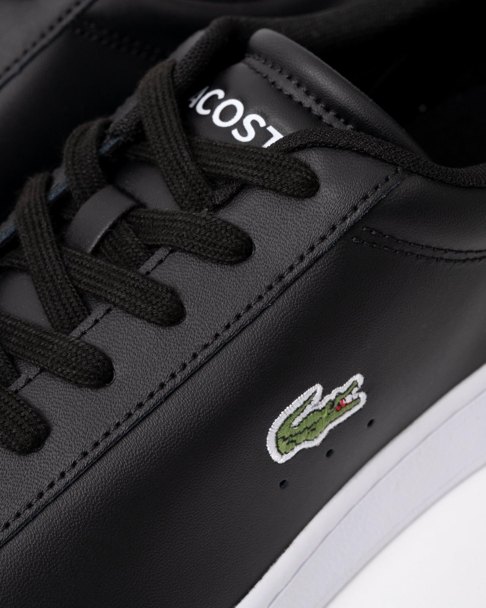 detail of Lacoste Carnaby Leather Mens Trainers in Black-White 312
