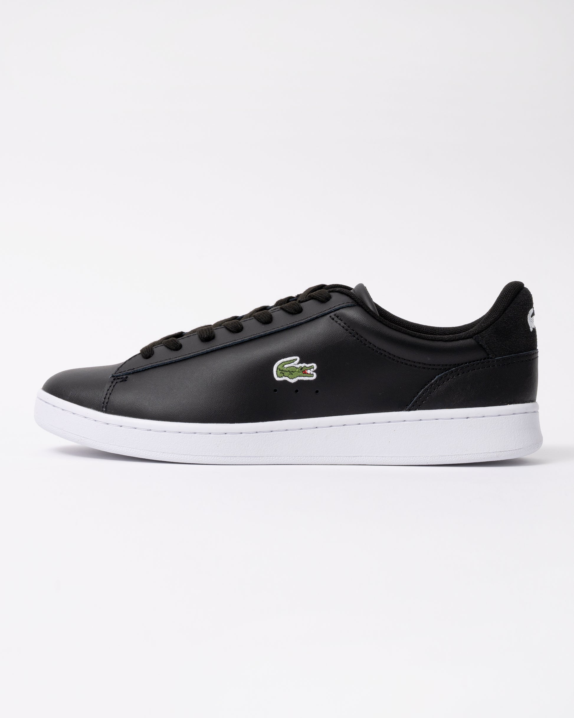 side view of Lacoste Carnaby Leather Mens Trainers in Black-White 312