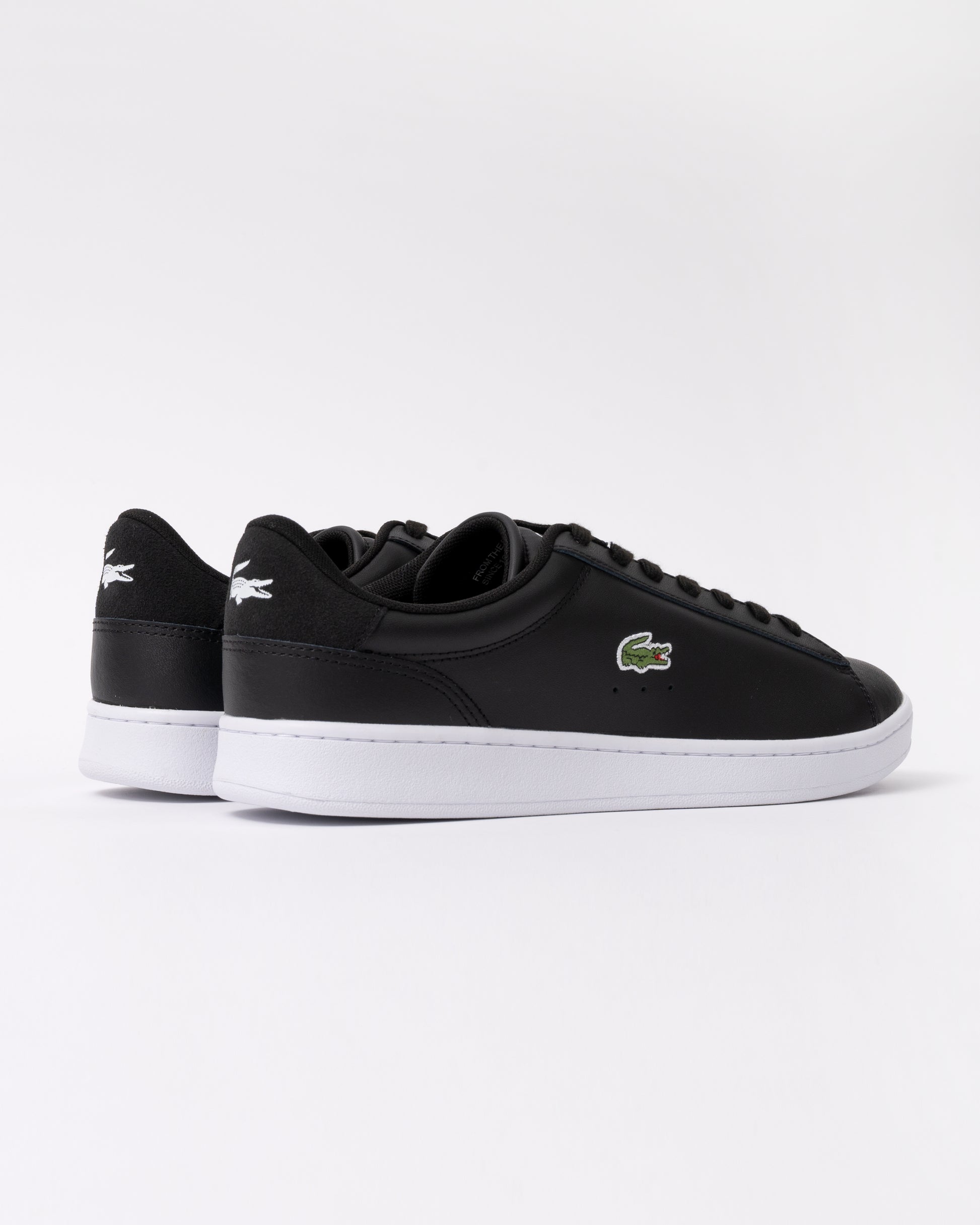 reverse view of Lacoste Carnaby Leather Mens Trainers in Black-White 312