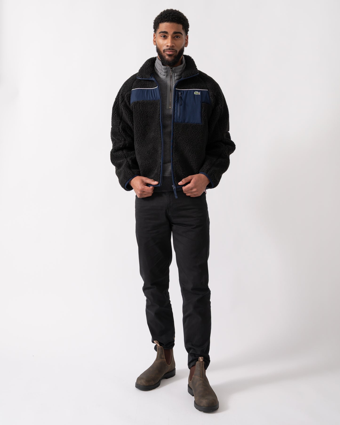 full length shot of a model wearing a Lacoste Colorblock Fleece Mens Zipped Jacket in Black and Navy Blue
