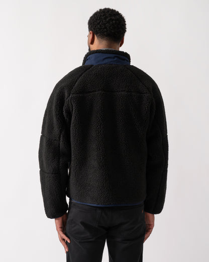 back shot of a model wearing a Lacoste Colorblock Fleece Mens Zipped Jacket in Black and Navy Blue