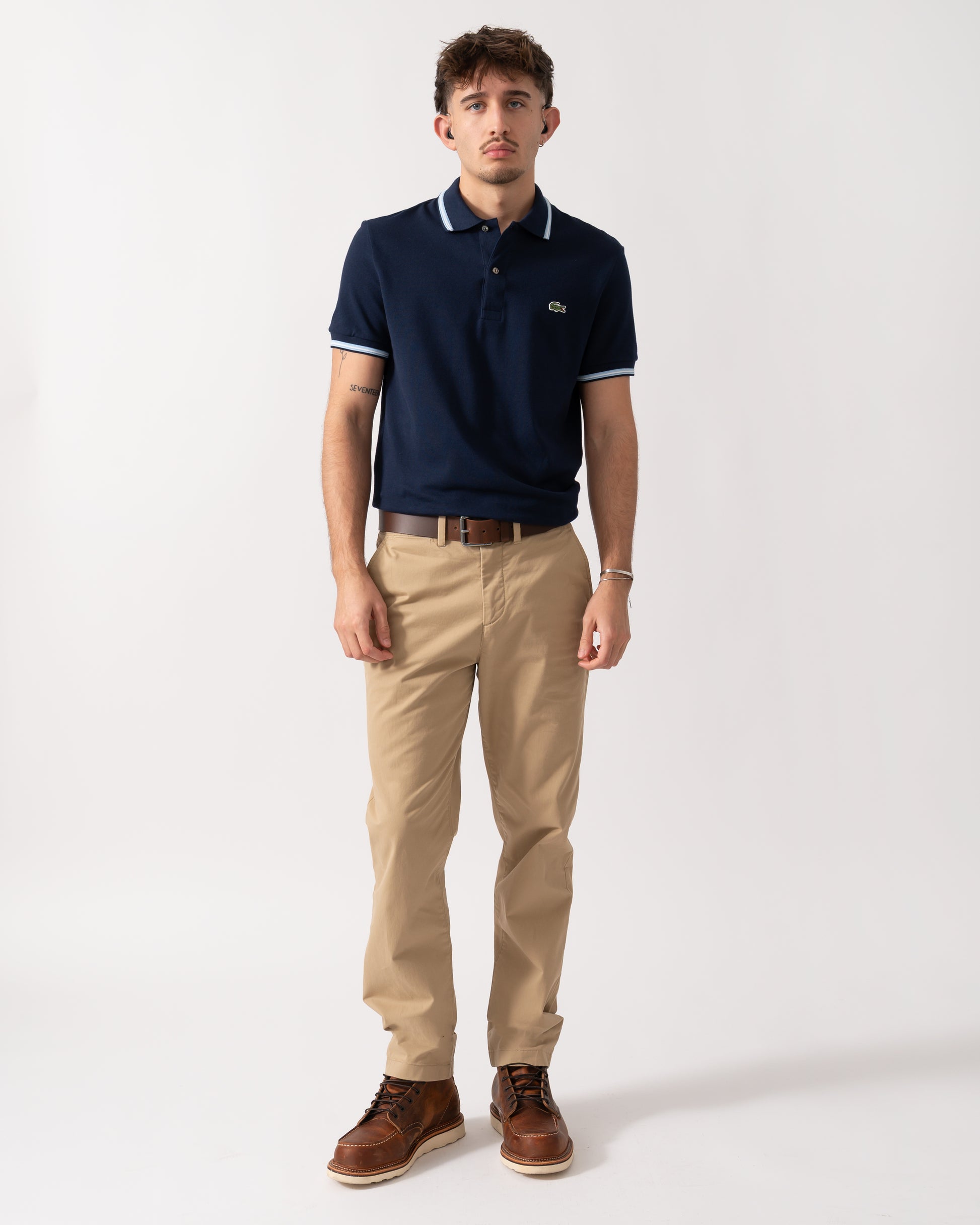 Full length shot of a Model wearing a Lacoste Contrast Collar Pique Mens Regular Fit Polo Shirt in Navy Blue