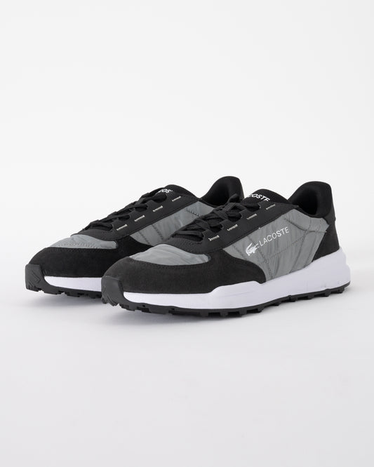 studio shot of Lacoste Elite Active Evo Mens Trainers in Black and White