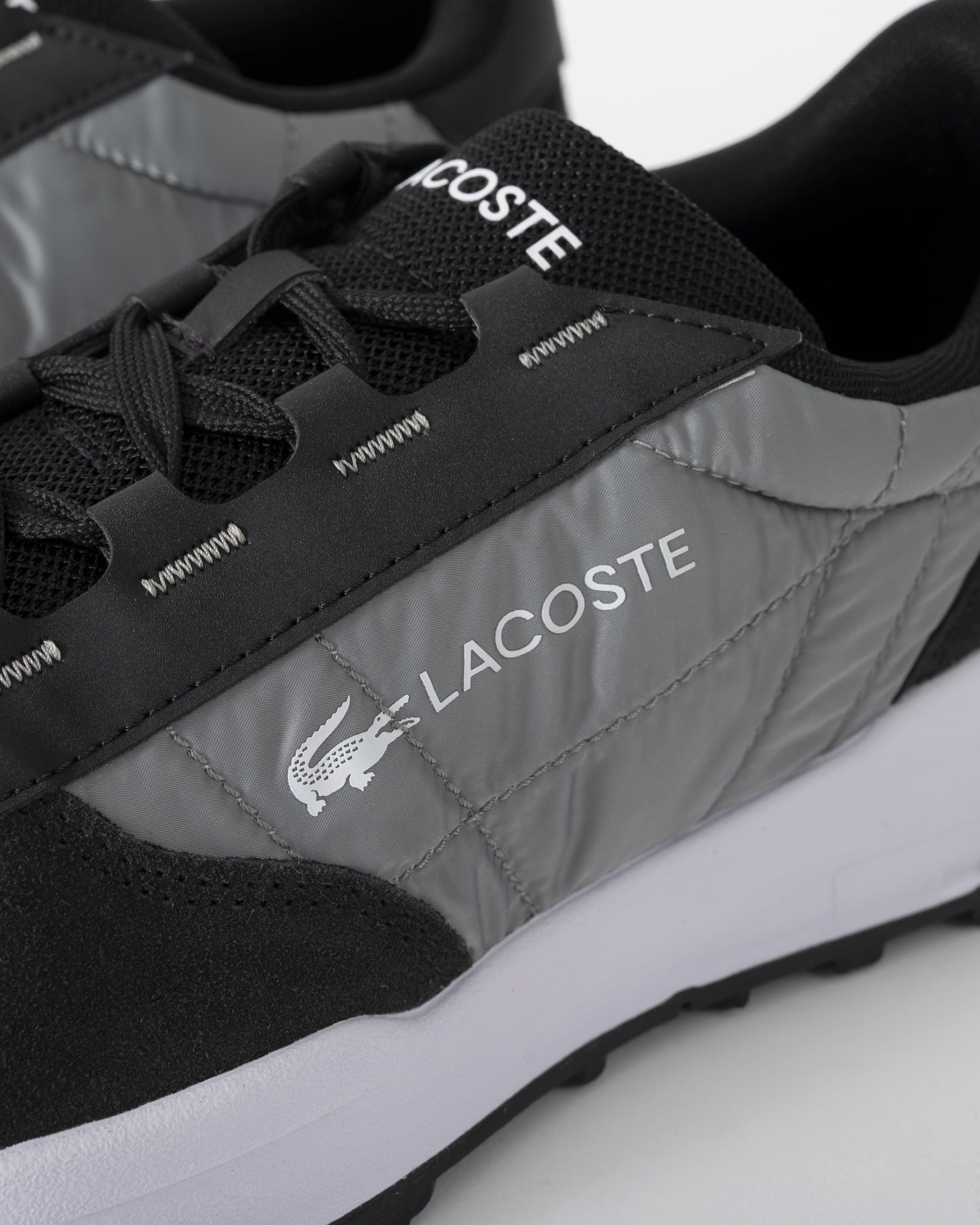 detail of Lacoste Elite Active Evo Mens Trainers in Black and White