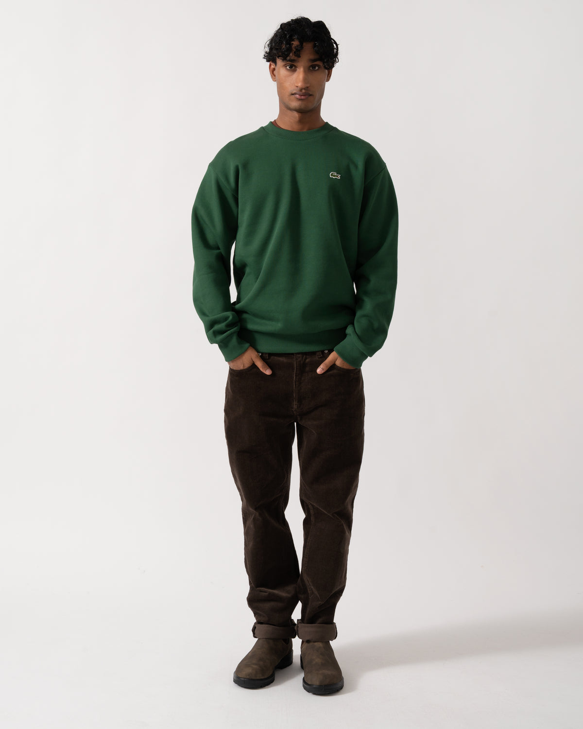 full length Studio photograph of a model wearing a Lacoste Fleece Mens Classic Fit Sweater in Pine Green 132