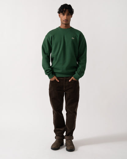 full length Studio photograph of a model wearing a Lacoste Fleece Mens Classic Fit Sweater in Pine Green 132