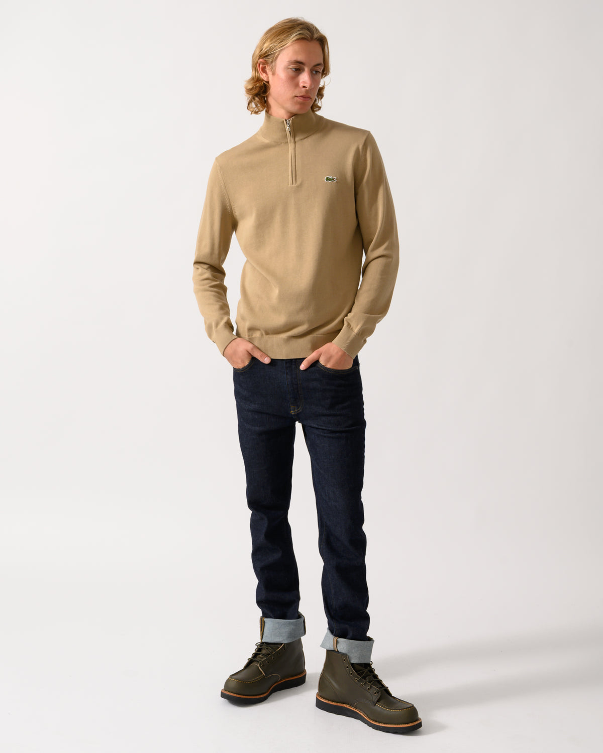 full length of a model wearing a Lacoste Half Zip Logo Mens Sweatshirt in Cookie SIX