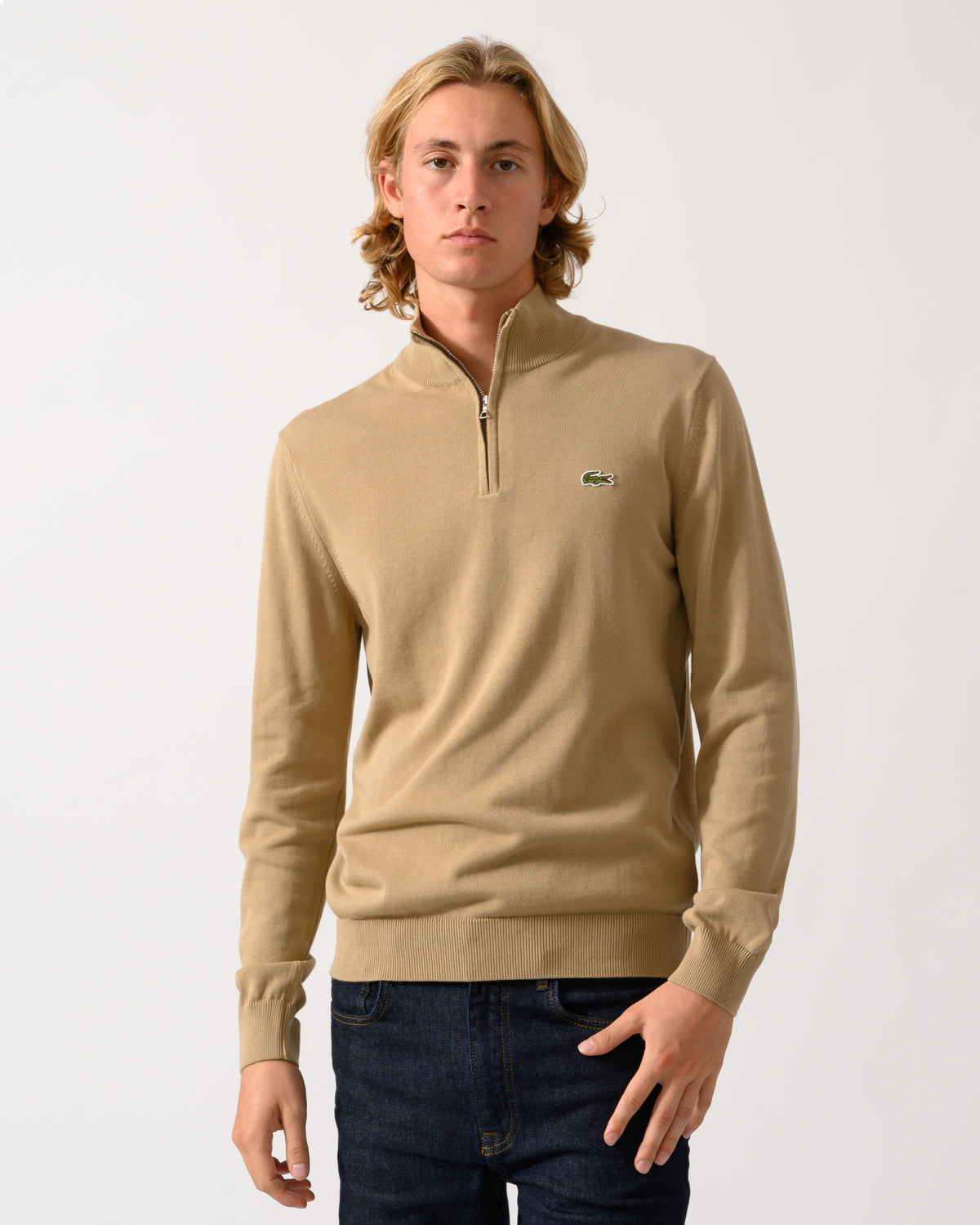 model wearing a Lacoste Half Zip Logo Mens Sweatshirt in Cookie SIX