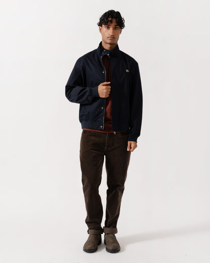 Man wearing the Lacoste Lightweight Water-Repellent Twill Mens Harrington Jacket - Abysm HDE