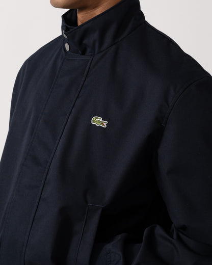 Logo detail on the Lacoste Lightweight Water-Repellent Twill Mens Harrington Jacket - Abysm HDE