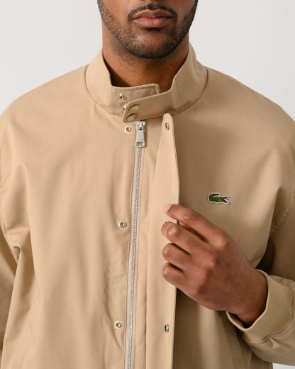 zip detail shot of a Lacoste Lightweight Water-Repellent Twill Mens Harrington Jacket in Viennese 02S