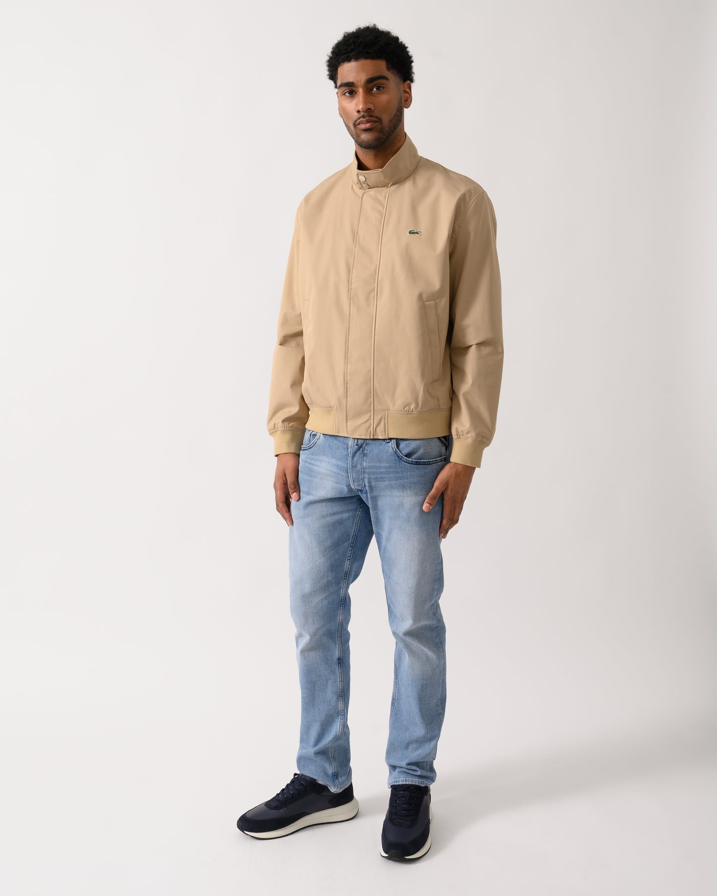 full length shot of a Model wearing a Lacoste Lightweight Water-Repellent Twill Mens Harrington Jacket in Viennese 02S