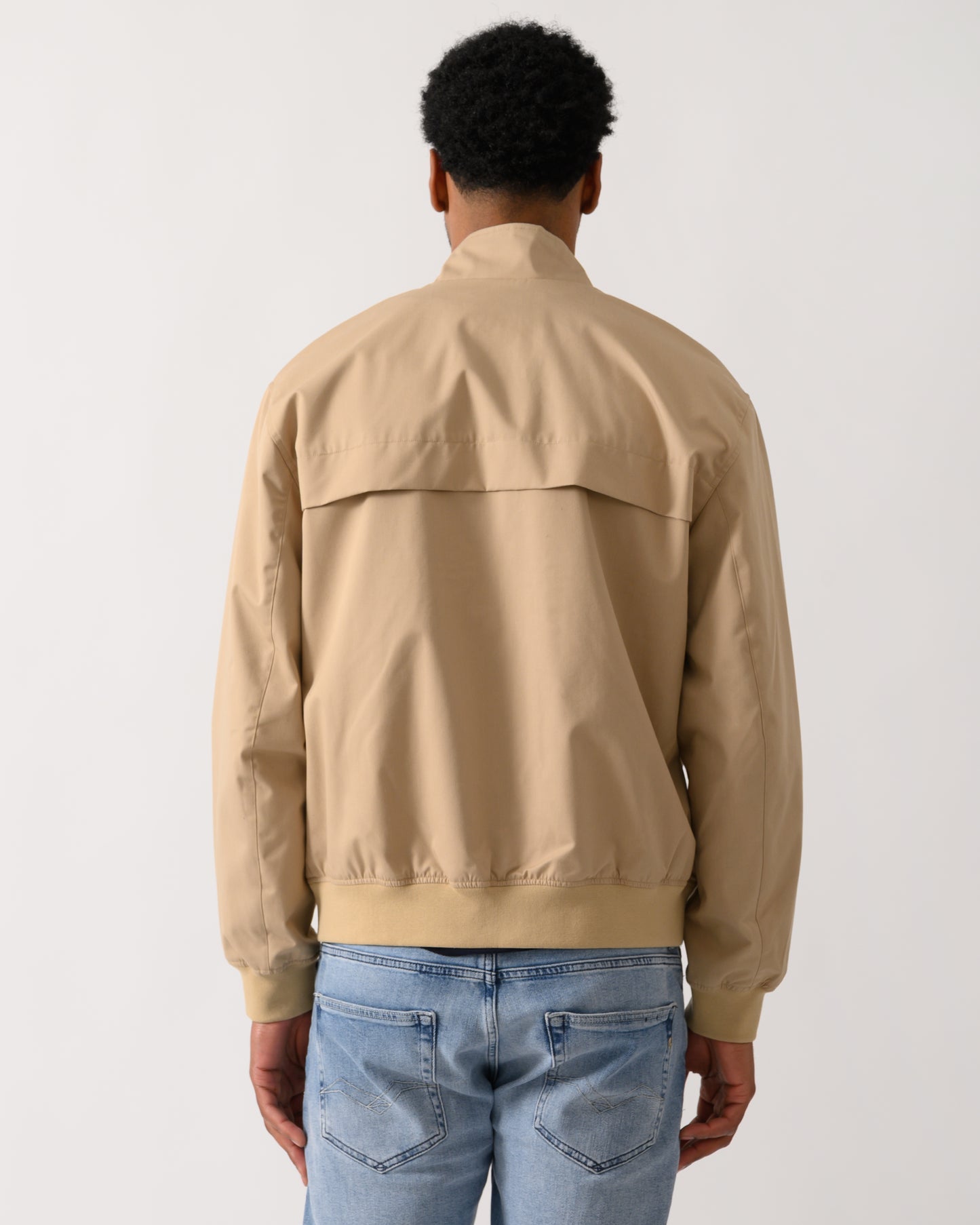 back shot of a Model wearing a Lacoste Lightweight Water-Repellent Twill Mens Harrington Jacket in Viennese 02S