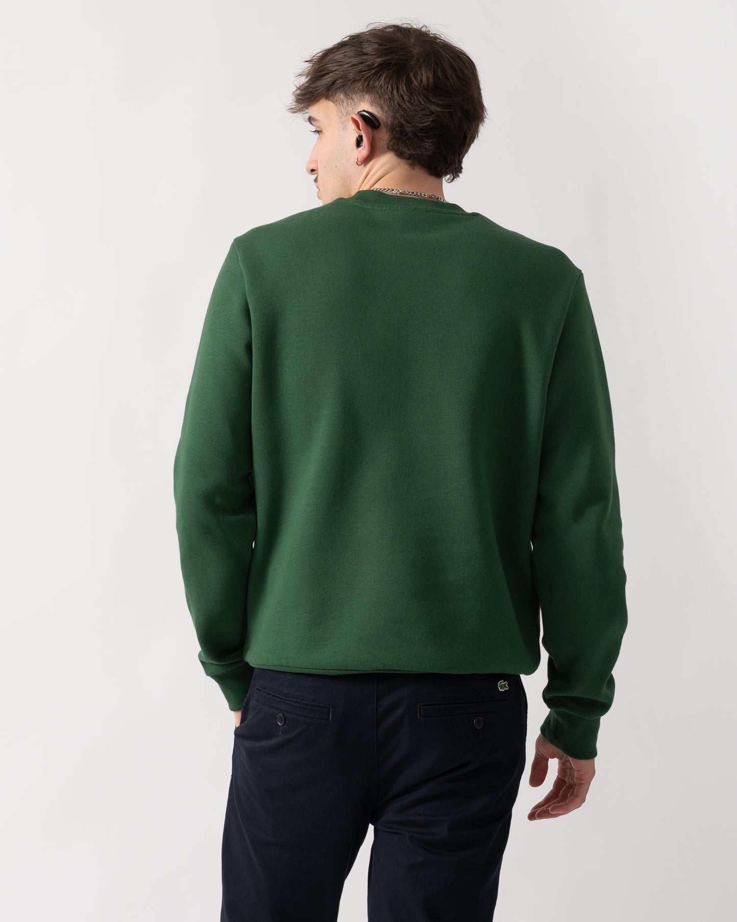 back shot of a model wearing a Lacoste Mens Crew Neck Fleece Sweatshirt in Green 132