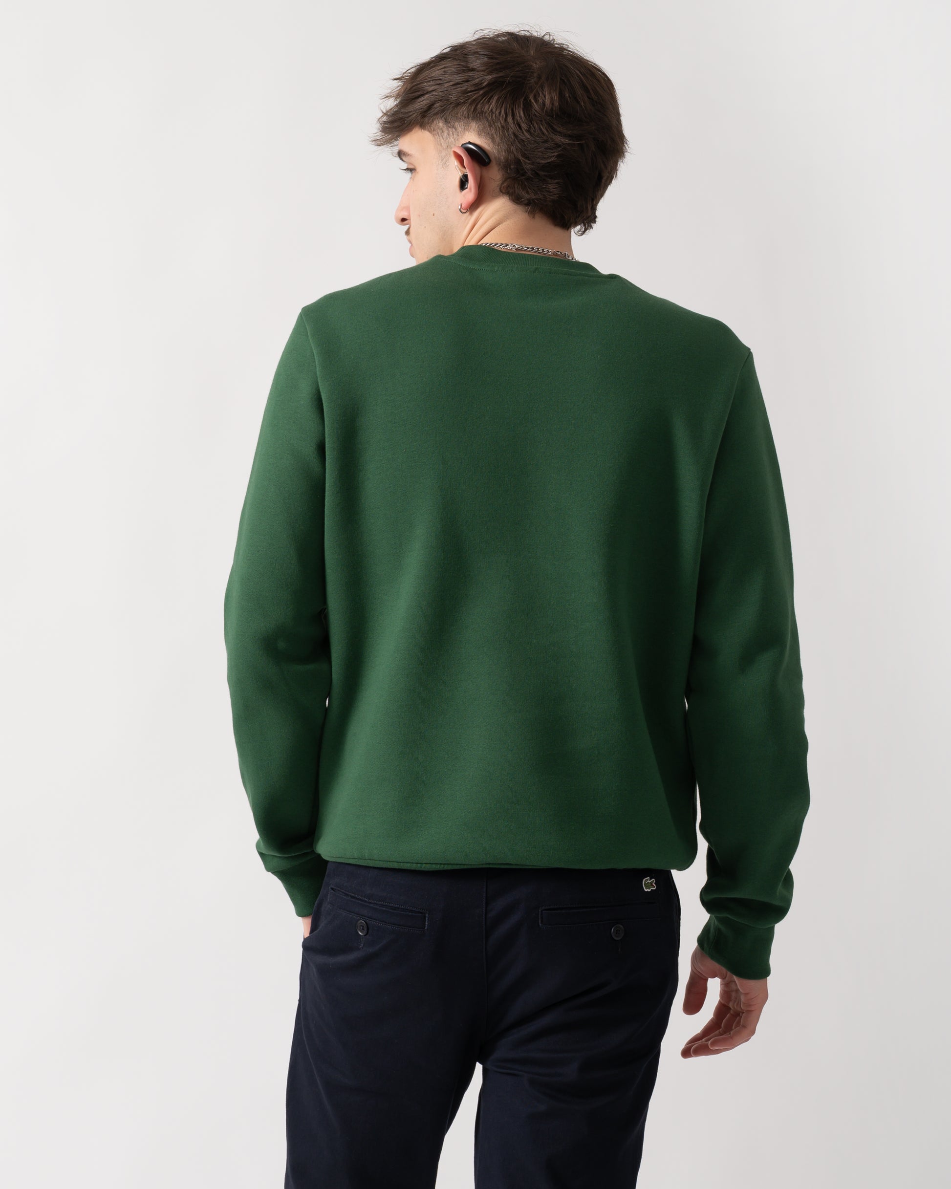 back shot of a model wearing a Lacoste Mens Crew Neck Fleece Sweatshirt in Green 132