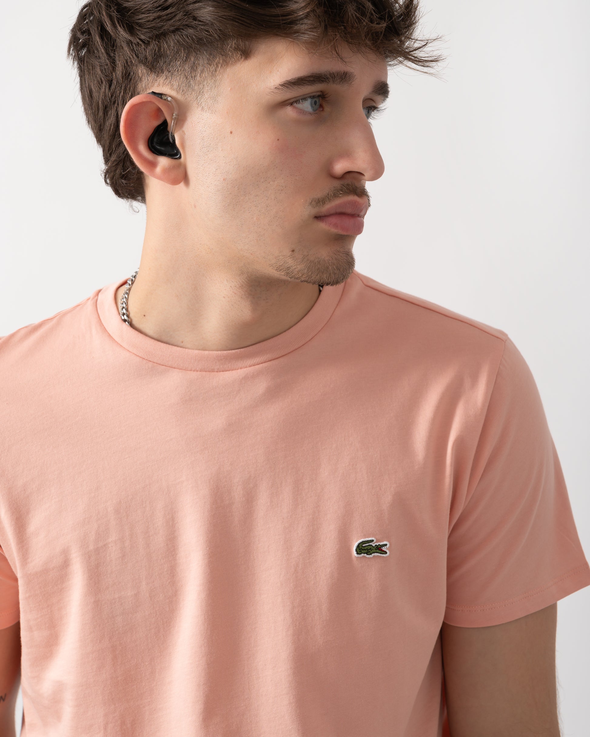 close up shot of model wearing a Lacoste Mens Crew Neck Pima Cotton Jersey T-Shirt in Miami UI2