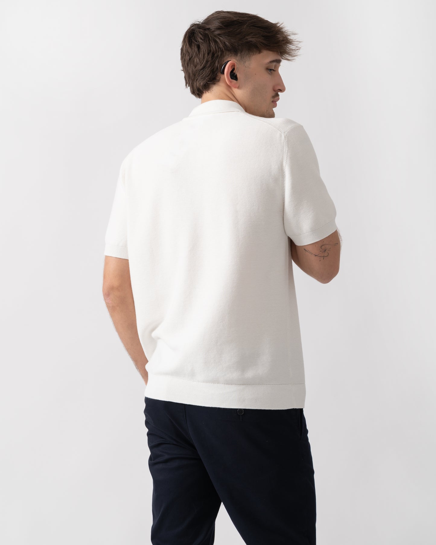back shot of a model wearing a Lacoste Moss Stitch Cotton Polo Collar Mens Sweater in Flour 70V