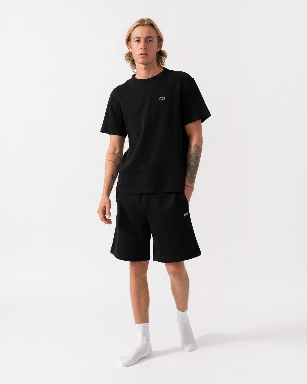 Model wearing the Lacoste Regular Fit Mens Fleece Shorts - Black 031