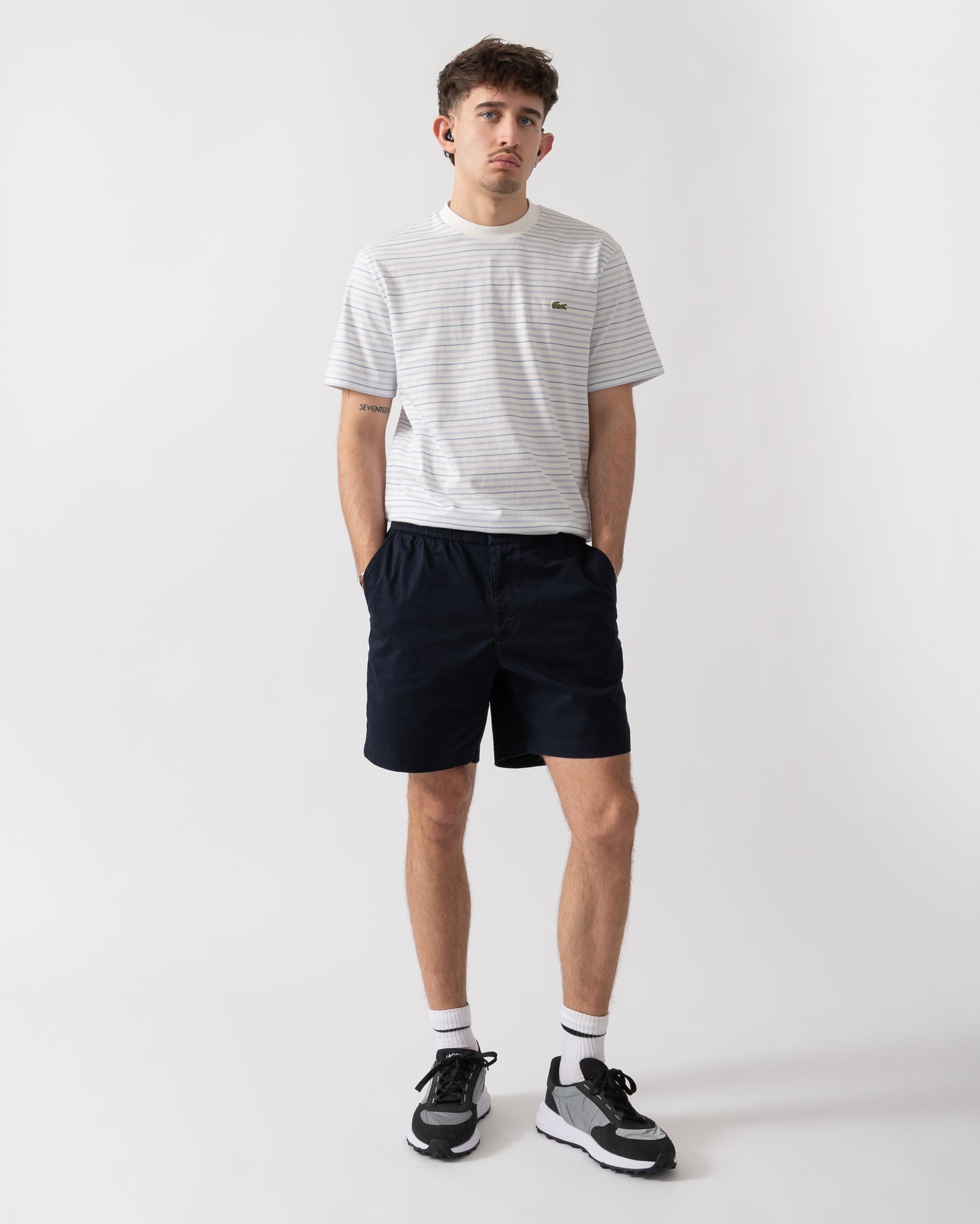 full length shot of a model wearing Lacoste Relaxed Fit Mens Stretch Cotton Shorts in Abysm HDE