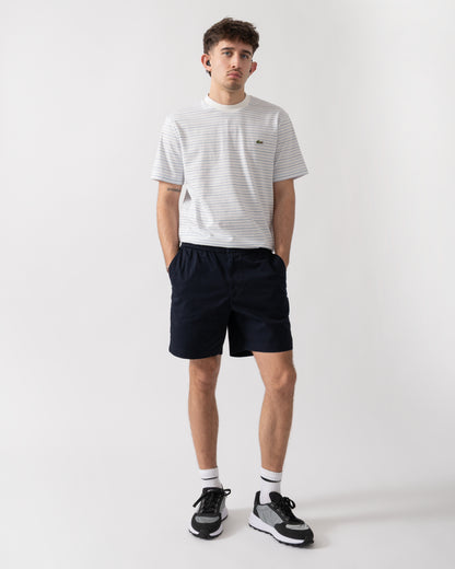 full length shot of a model wearing Lacoste Relaxed Fit Mens Stretch Cotton Shorts in Abysm HDE