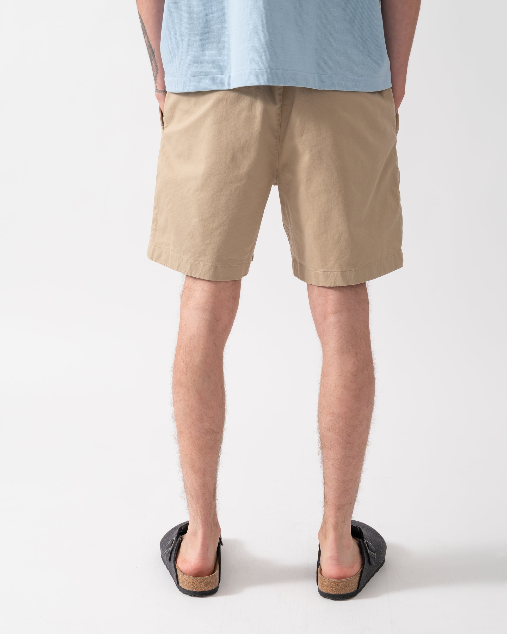 back of model wearing Lacoste Relaxed Fit Mens Stretch Cotton Shorts in Viennese 02S