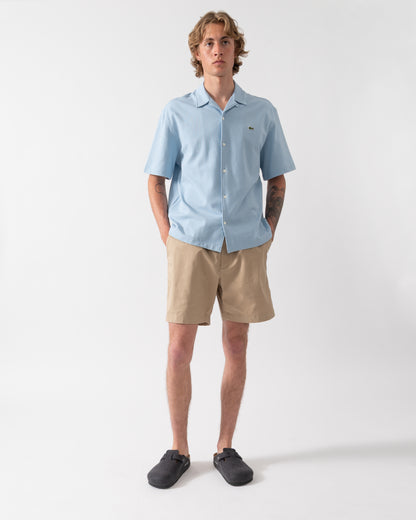 model wearing Lacoste Relaxed Fit Mens Stretch Cotton Shorts in Viennese 02S