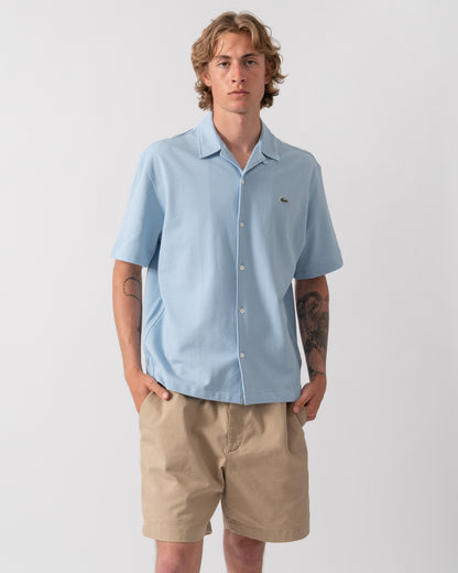 model wearing a Lacoste Relaxed Fit Short Sleeved Mens Piqué Shirt in Chambray HBA