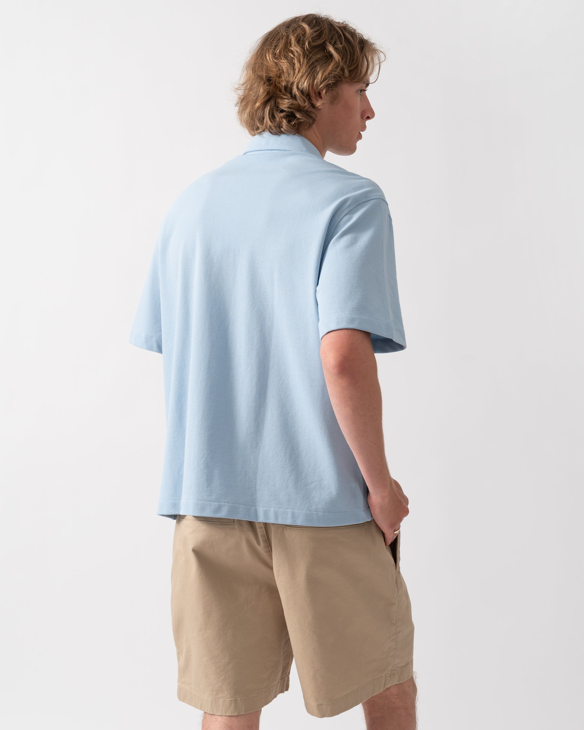 back of a model wearing a Lacoste Relaxed Fit Short Sleeved Mens Piqué Shirt in Chambray HBA