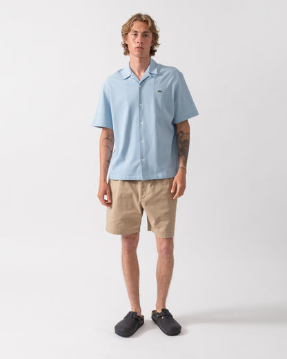 full length shot of a model wearing a Lacoste Relaxed Fit Short Sleeved Mens Piqué Shirt in Chambray HBA