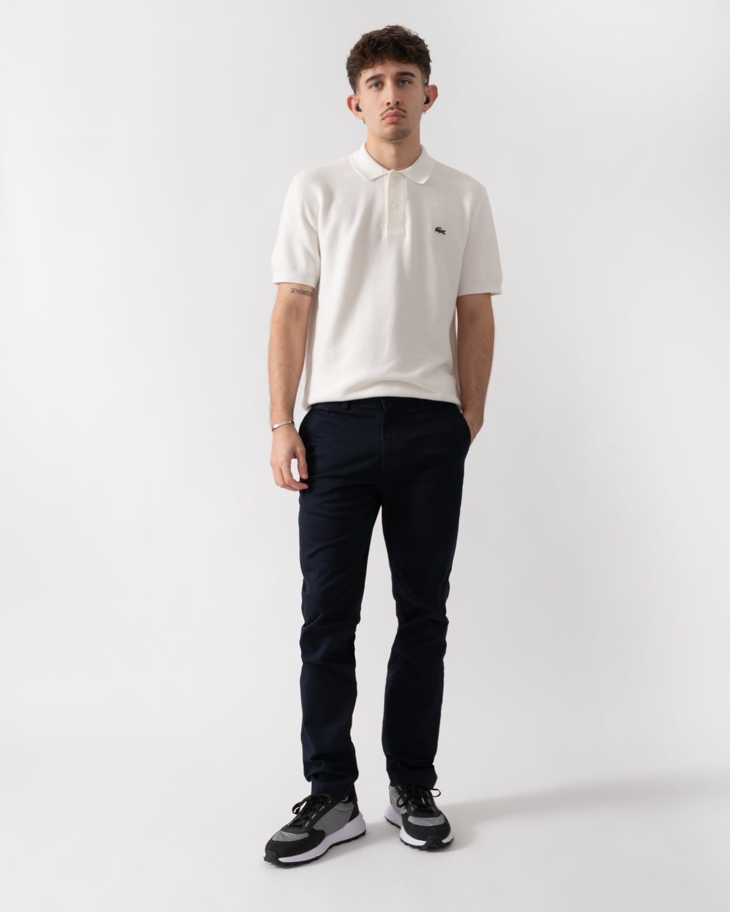 full length shot of a model wearing Lacoste Slim Fit Stretch Cotton Mens Chinos in Abysm HDE
